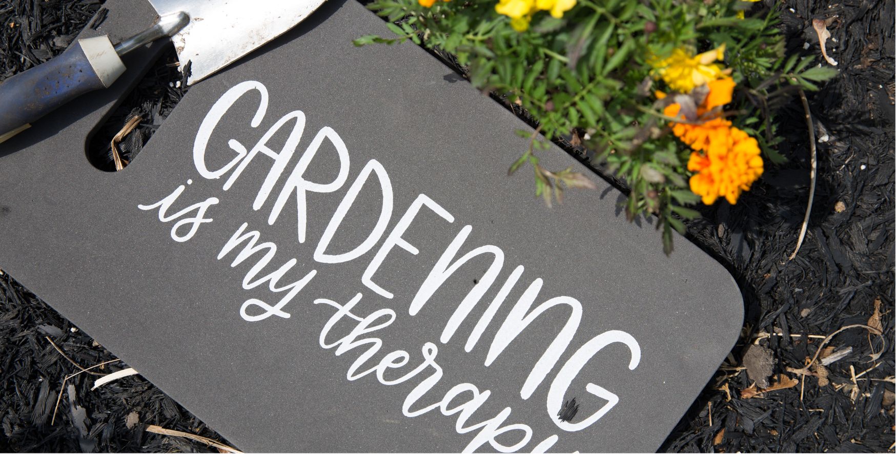 Kneeling pad that says 'Gardening is my therapy'